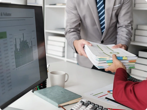 Two professionals reviewing financial documents together
