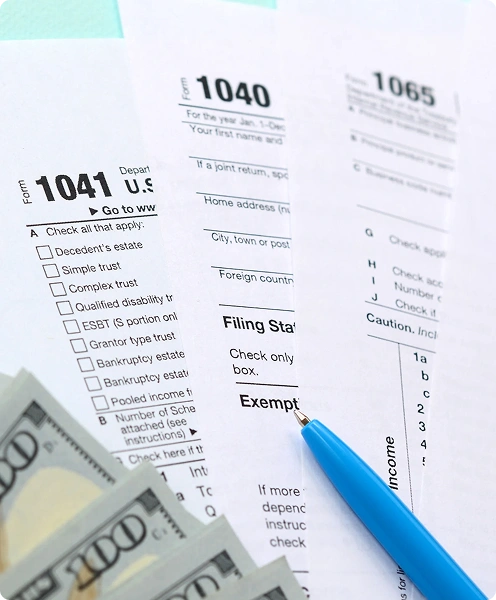 Two professionals reviewing payroll tax documents