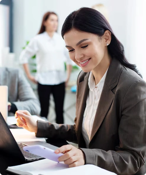 Smiling business professional reviewing documents