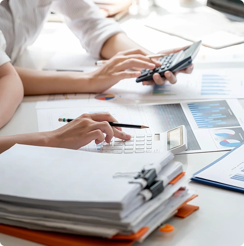 Two professionals reviewing financial documents together